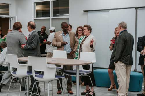 Attendees mingling at the center ribbon cutting ceremony.